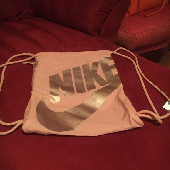 Nike copper colored draw string bag. Authentic. New and never carried/used.